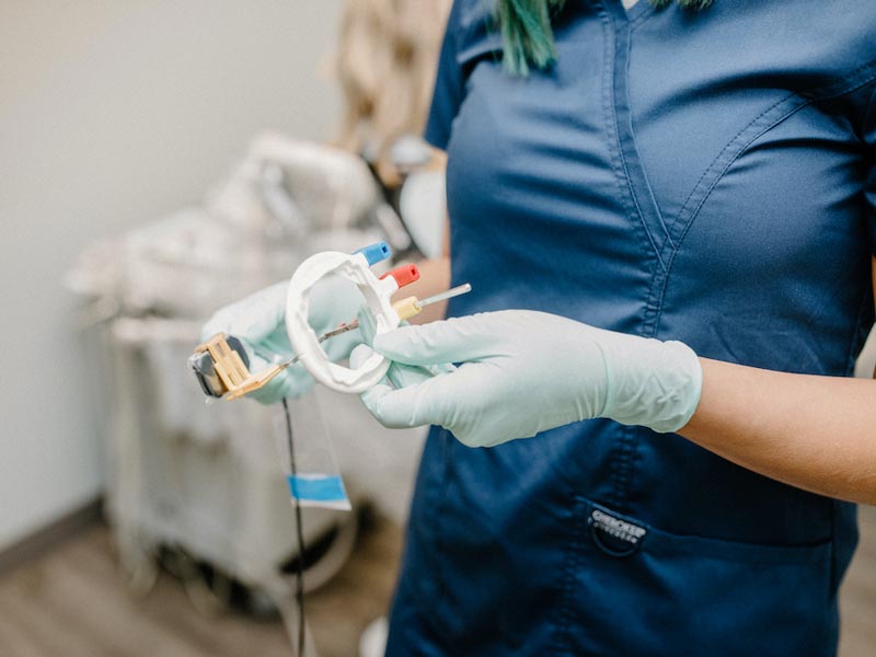 dentist with tool in hand