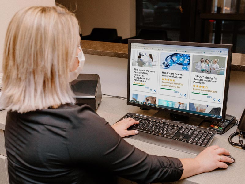 woman looking at computer